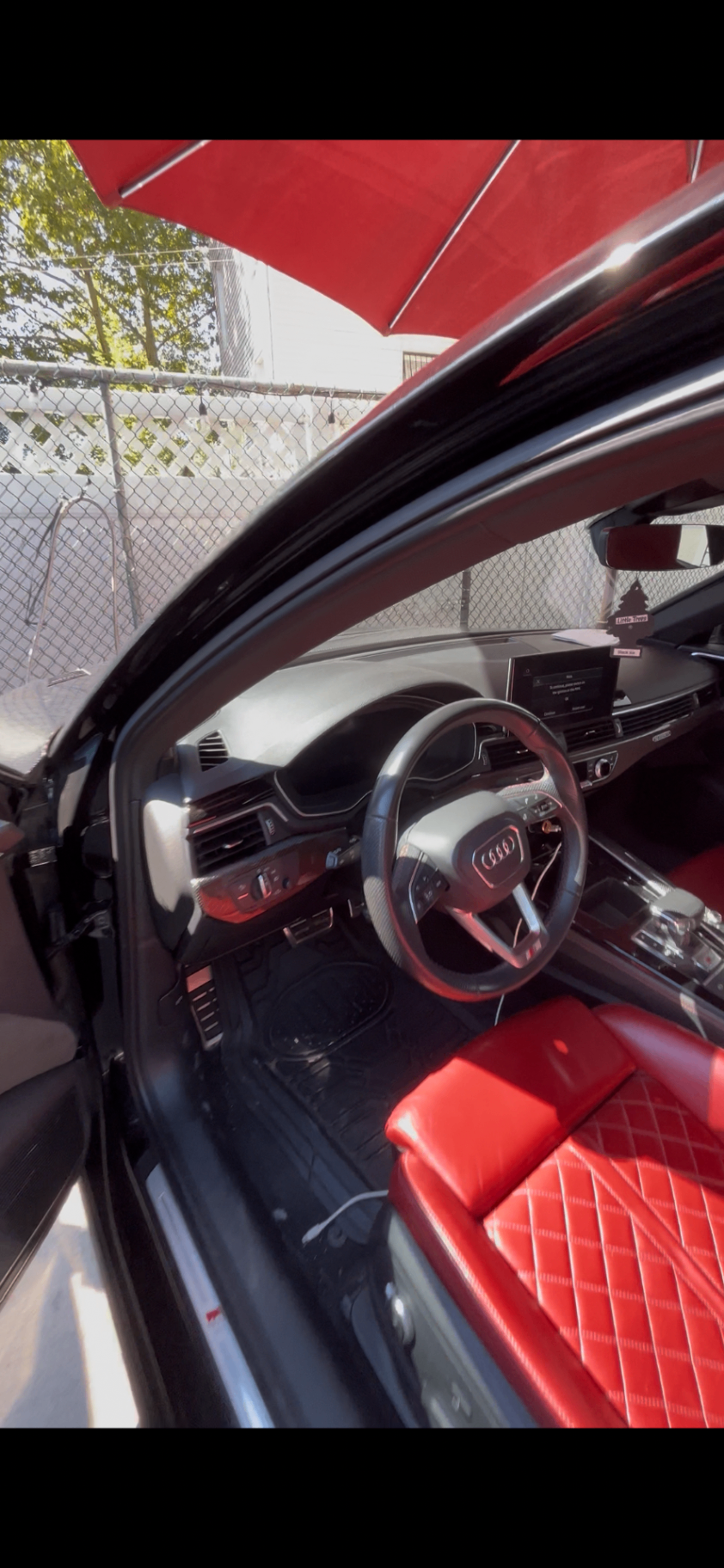 Audi S4 interior detailed — red leather and dash wiped down